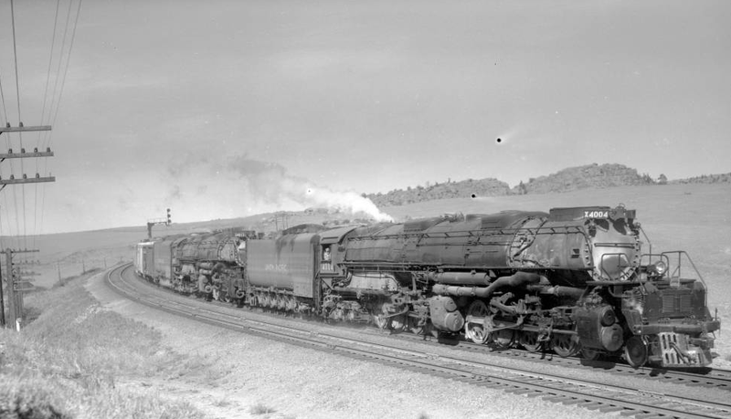 Two big boys hitched together to pull an especially heavy load of 90 cars in 1958.